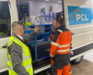 PCL's Michael Dooker speaking to a Pirtek Preston Customer next to the PCL Demo Van at their Open Day